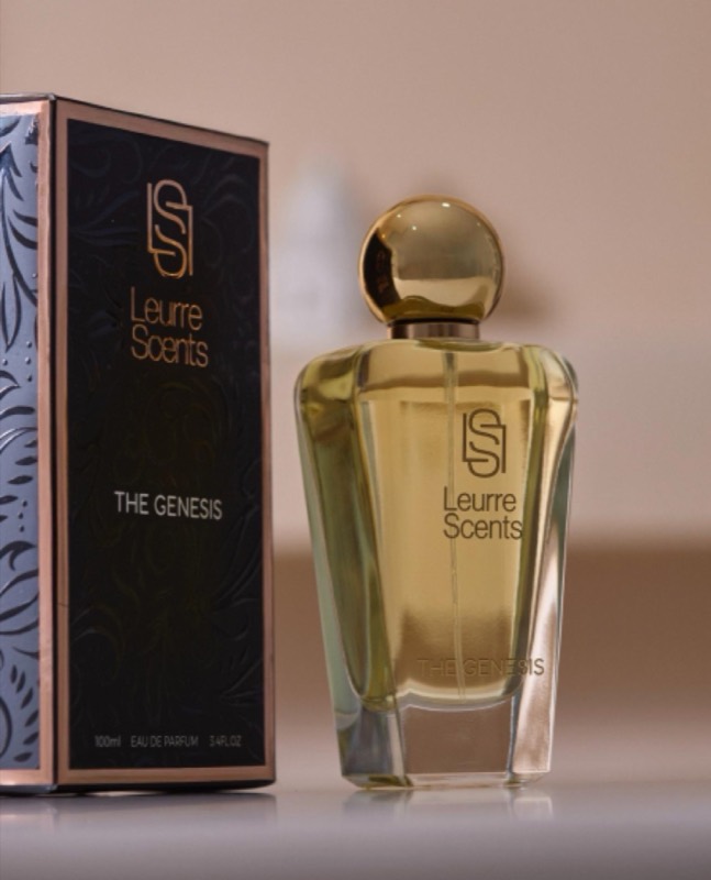 The Genesis bottle with its black box on a cream surface