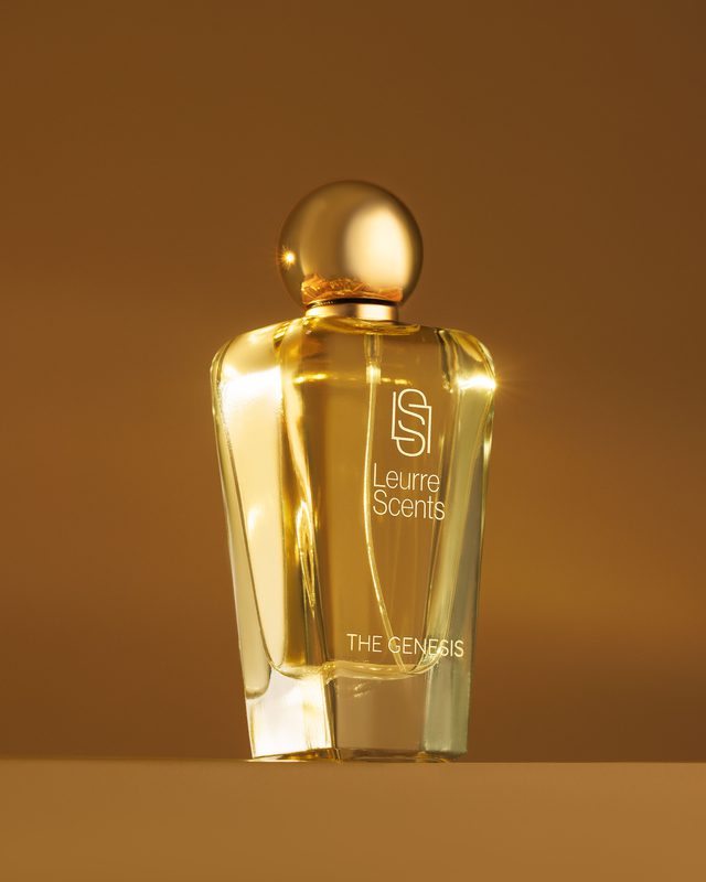 The Genesis bottle glowing against an amber backdrop