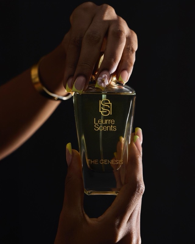 Hands holding The Genesis bottle