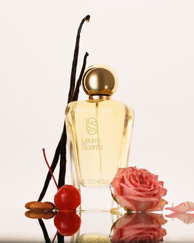 The Genesis bottle with vanilla pods, a cherry and a rose